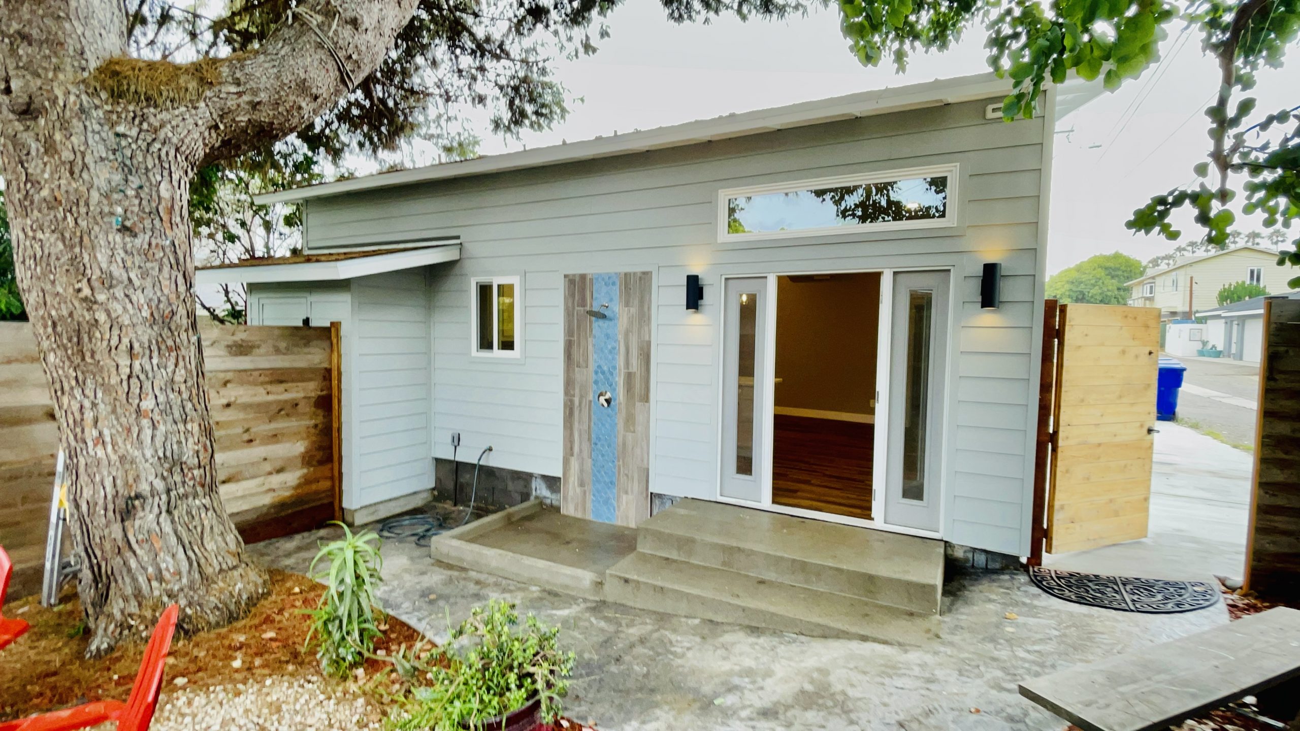 Finished South Oceanside detached garage-to-ADU exterior with private entry and outdoor connection