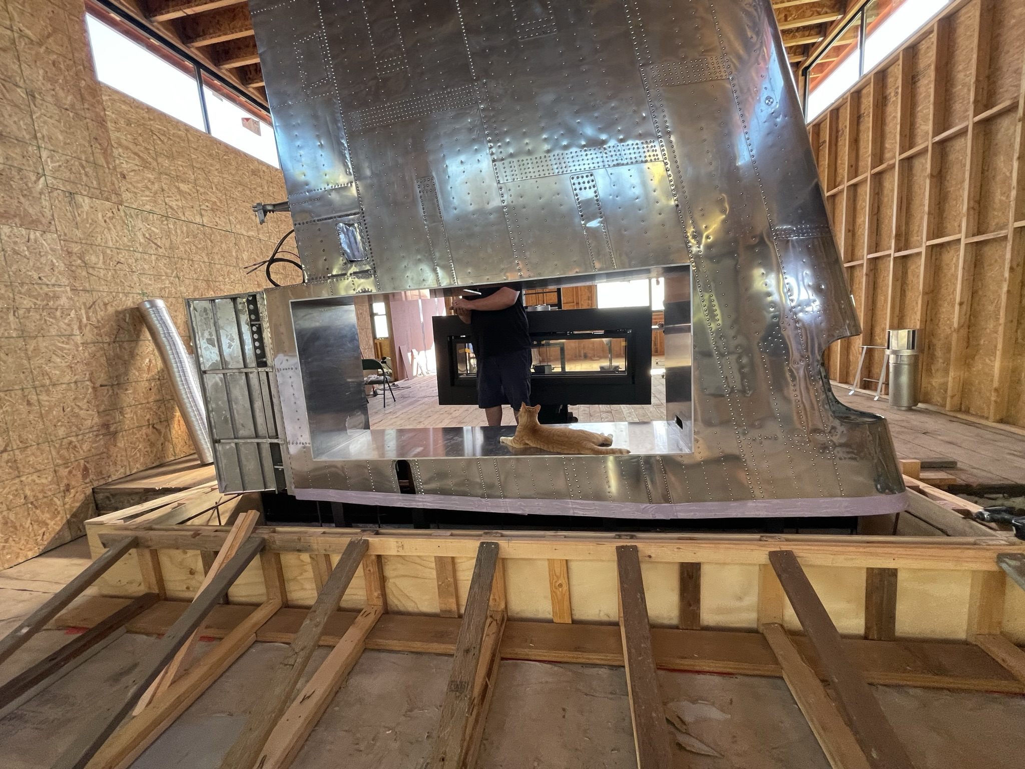 Grandview custom fireplace and metal surround installation during construction