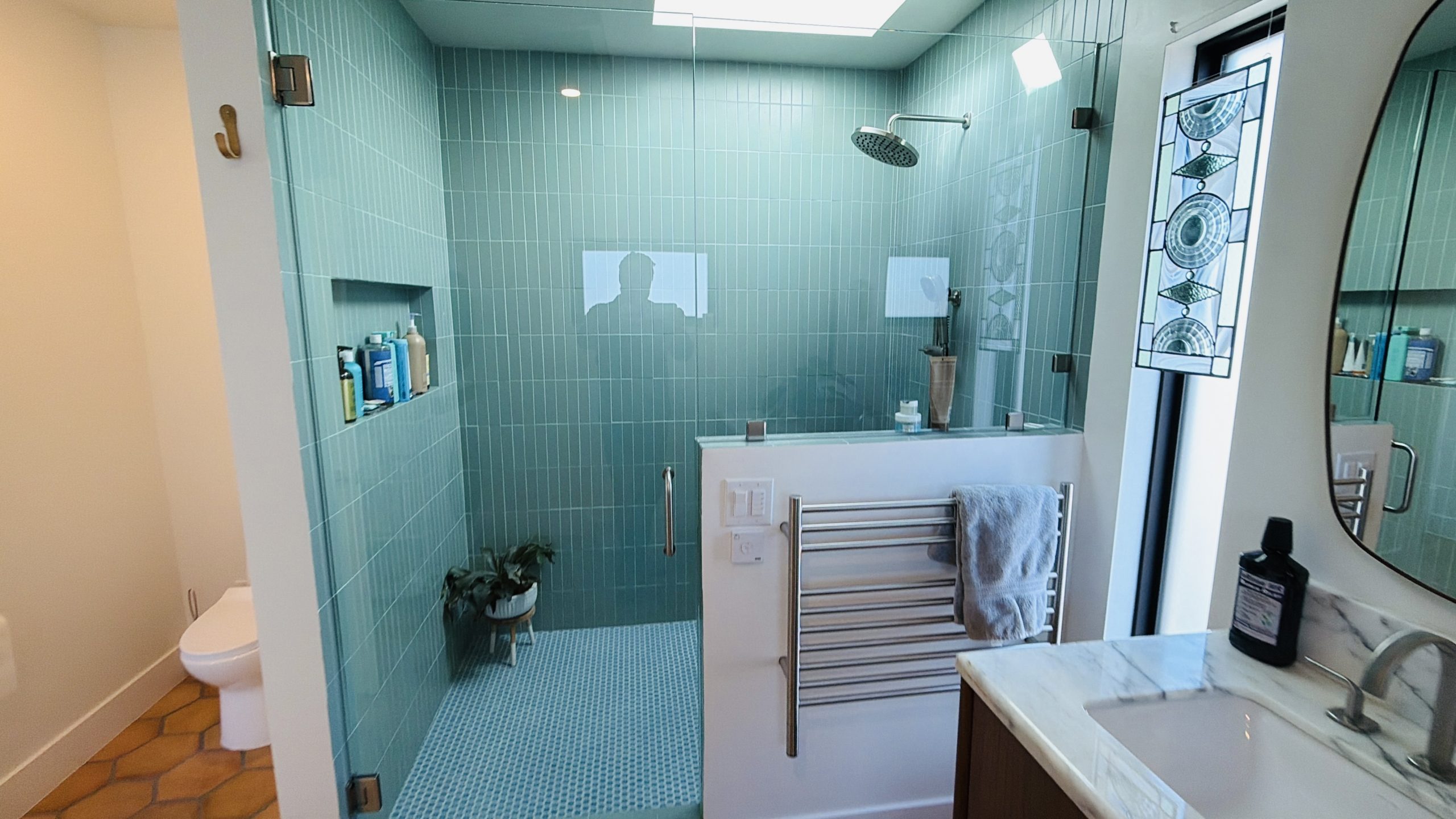 Finished teal tile wet room with skylight in the South Oceanside remodel