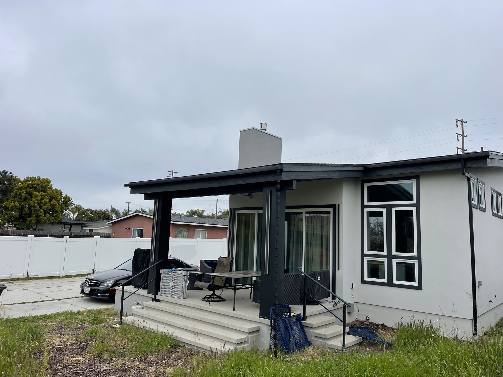 Completed 2,200 sq. ft. modern Encinitas ADU and garage with a covered entry and contemporary exterior