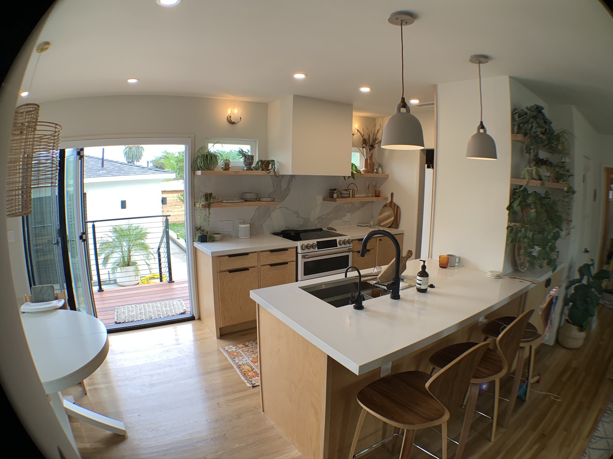 Completed kitchen remodel with upgraded cabinetry, counters, and lighting