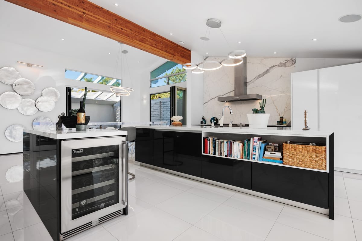 Kitchen island, wood beam, and finished interior detail from the Omori remodel