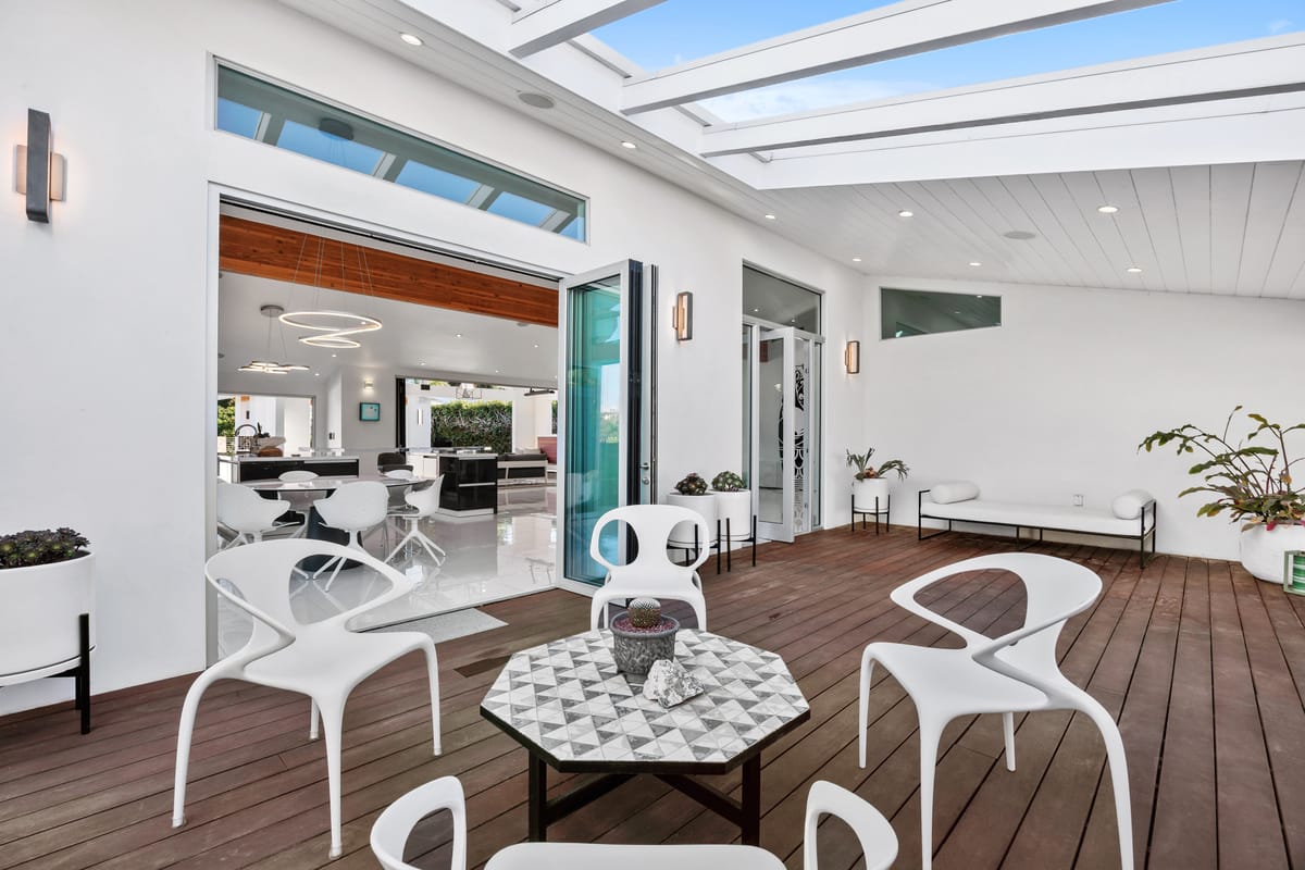 Estrella del Mar remodel: Covered deck connecting the indoor dining area to outdoor living.