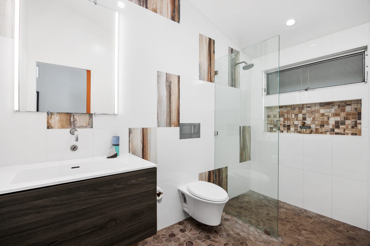Estrella del Mar remodel: Custom bathroom with detailed mosaic shower finishes.
